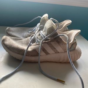 Well-worn ladies adidas sneakers